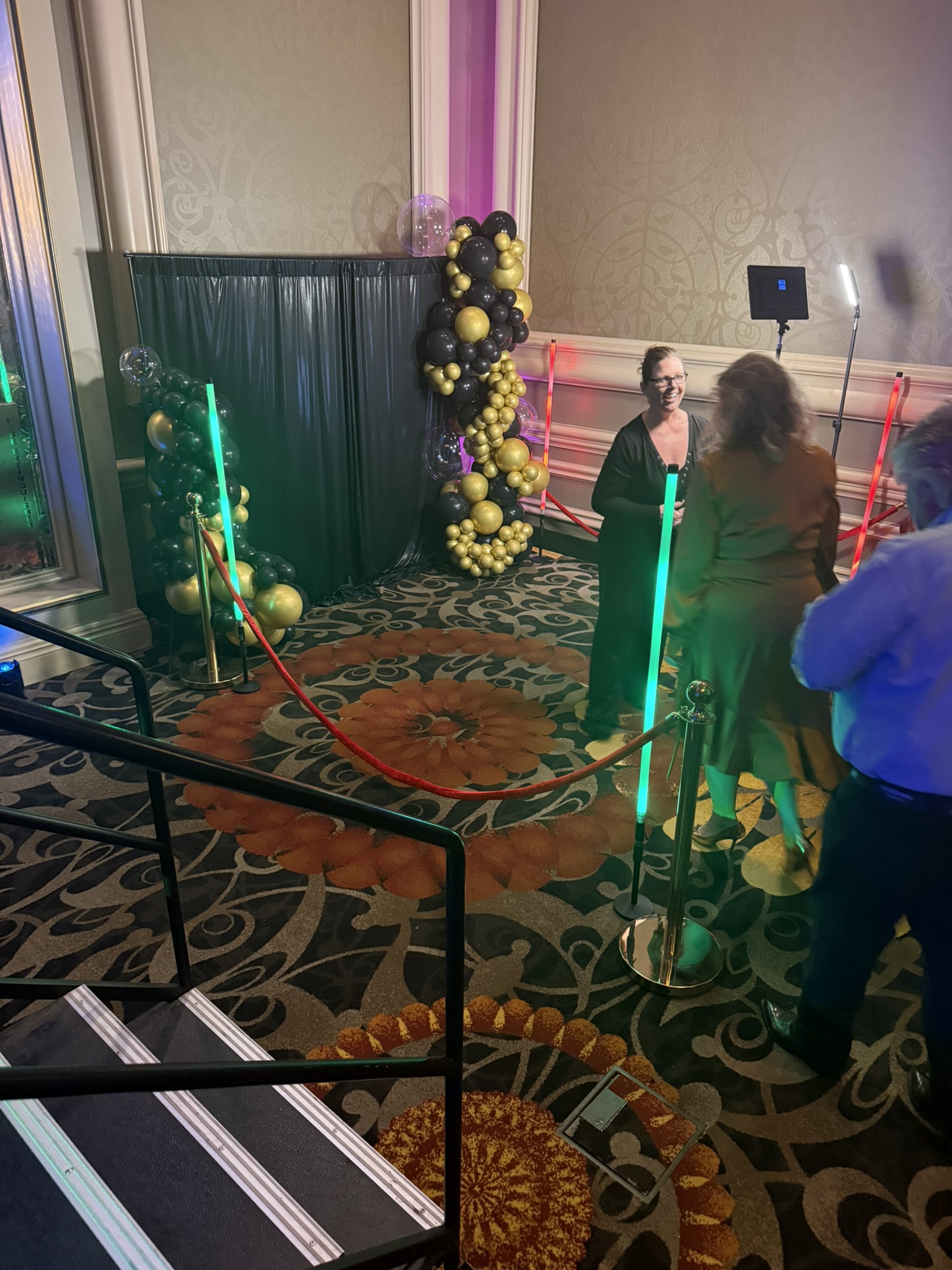Hotel ballroom corporate photo booth activation with gold balloon arch and LED lights, Tucson AZ